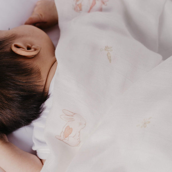 baby swaddle blankets 100% bamboo with pink bunny designs on a white background