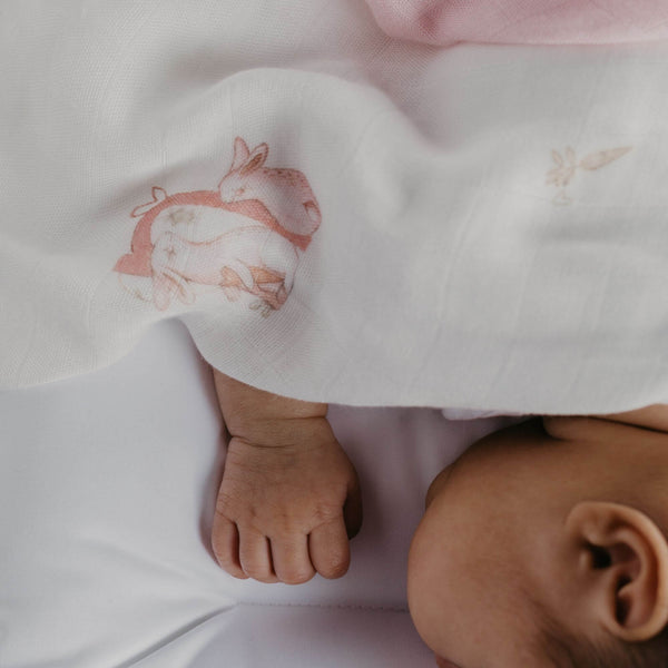 baby swaddle blankets 100% bamboo with pink bunny designs on a white background